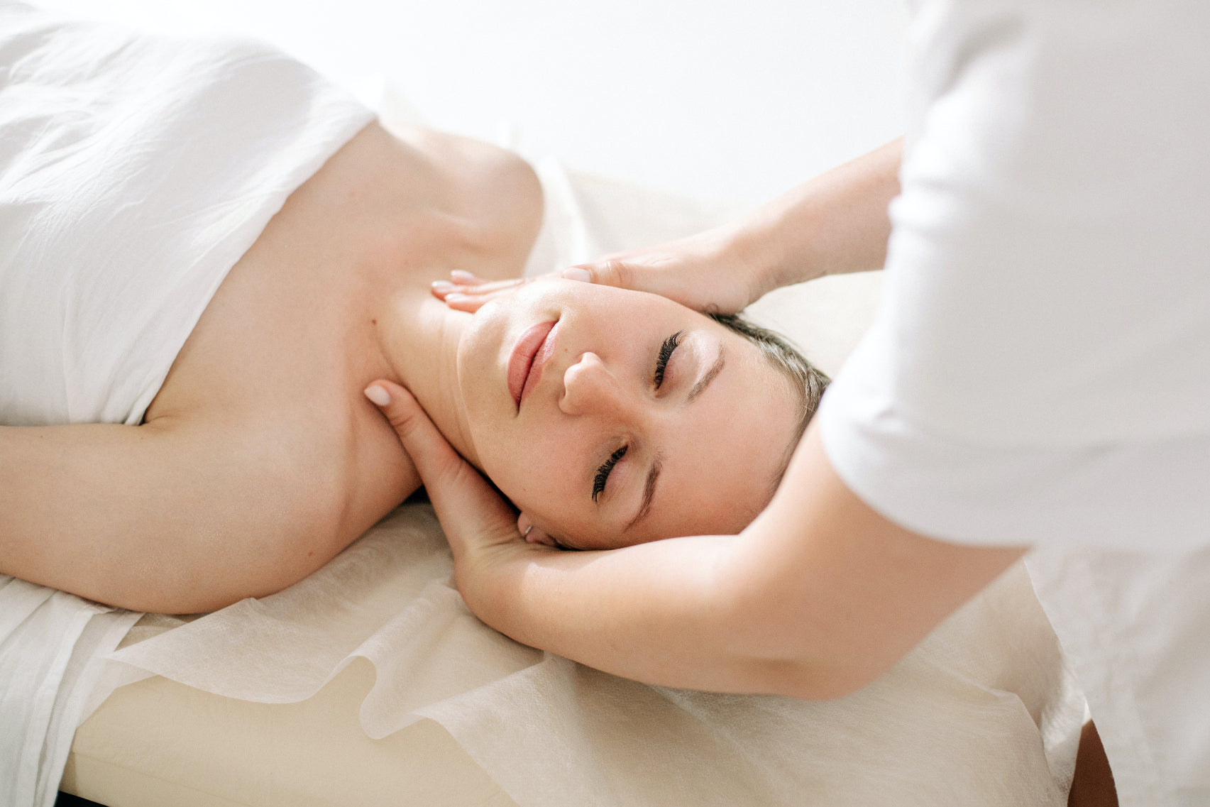 Woman receiving a relaxing massage in a beauty salon